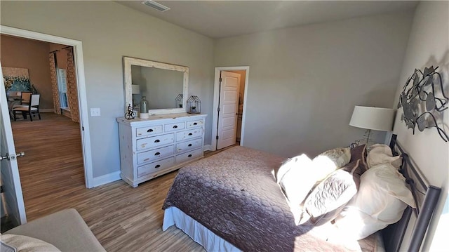 bedroom with light wood-type flooring