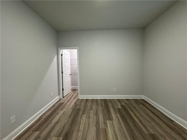 empty room featuring dark hardwood / wood-style floors