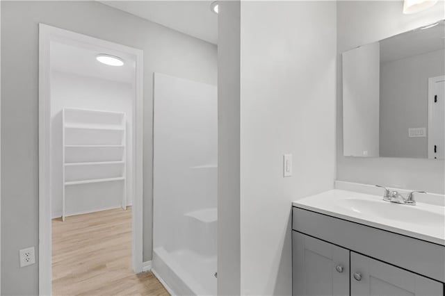 bathroom featuring vanity and hardwood / wood-style flooring