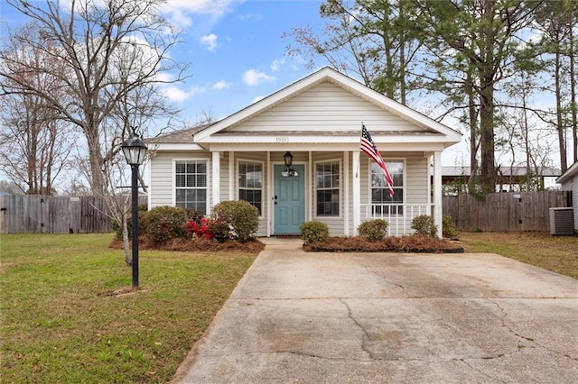 bungalow-style house with a front yard, cooling unit, fence, a porch, and concrete driveway