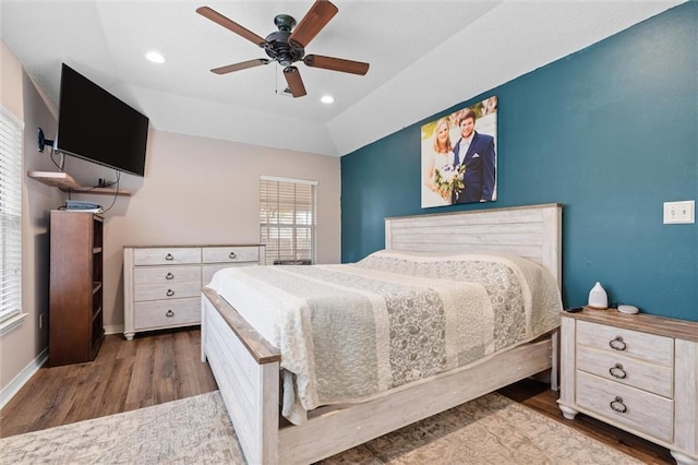 bedroom with a ceiling fan, recessed lighting, wood finished floors, and baseboards