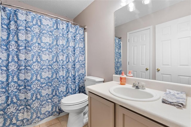 full bathroom with a textured ceiling, toilet, vanity, and tile patterned flooring