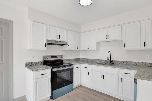 kitchen featuring sink, stainless steel range with electric stovetop, light wood-type flooring, light stone countertops, and white cabinets