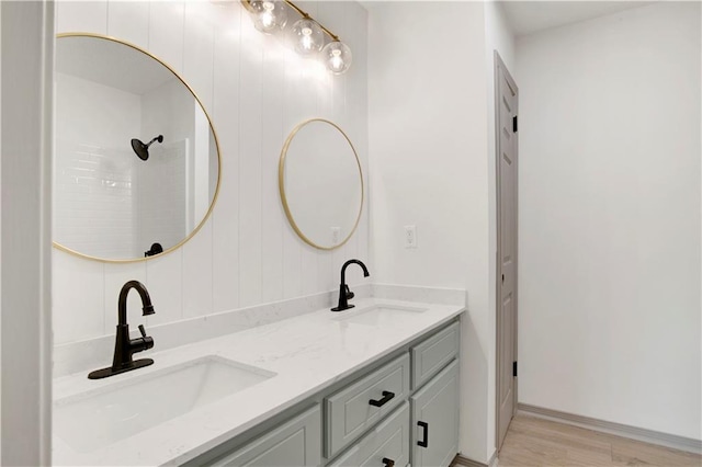 bathroom with vanity and hardwood / wood-style floors