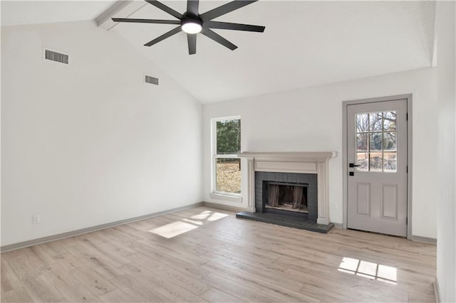 unfurnished living room with high vaulted ceiling, a brick fireplace, light hardwood / wood-style flooring, beamed ceiling, and ceiling fan