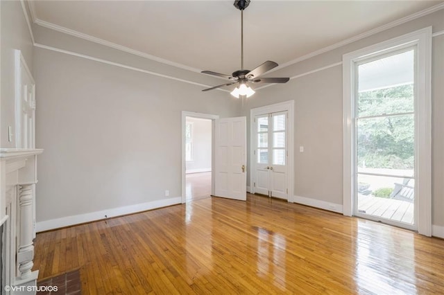 unfurnished living room featuring hardwood / wood-style floors, ceiling fan, and ornamental molding