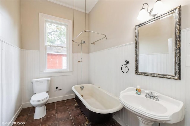 bathroom with sink, tile patterned flooring, a bath, and toilet