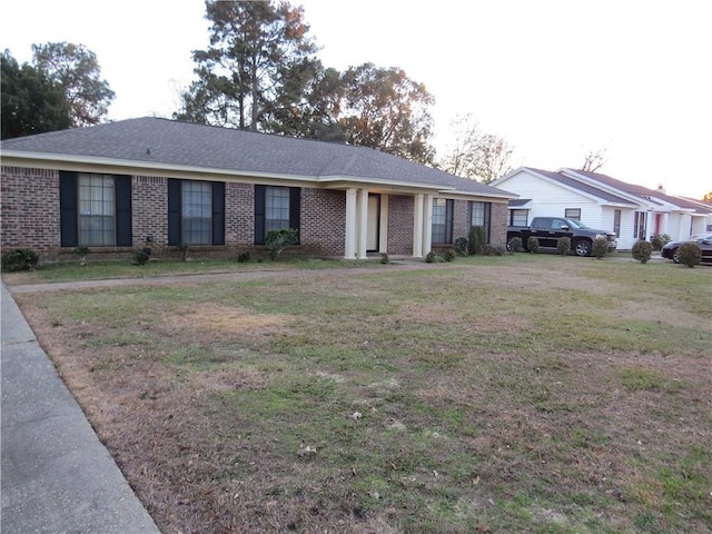 ranch-style home with a front yard