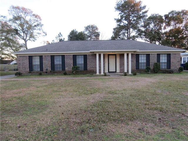 ranch-style house with a front yard