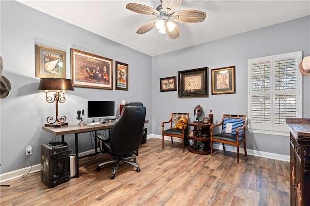 office space featuring light hardwood / wood-style floors and ceiling fan