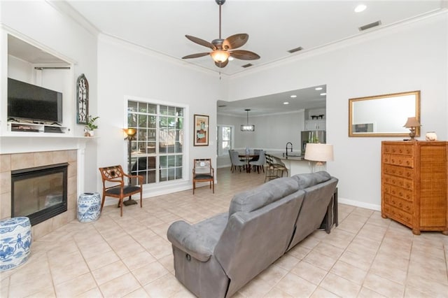 8814 Dawes Lake Rd N, Mobile, AL 36619 - living area featuring light tile patterned floors, visible vents, a ceiling fan, and ornamental molding