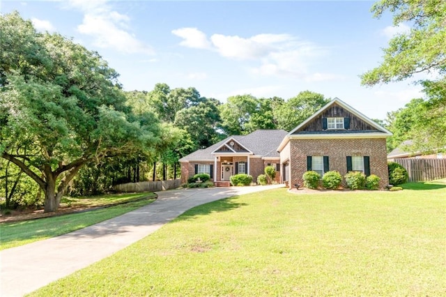 8814 Dawes Lake Rd N, Mobile, AL 36619 - view of front facade featuring concrete driveway, an attached garage, and a front yard