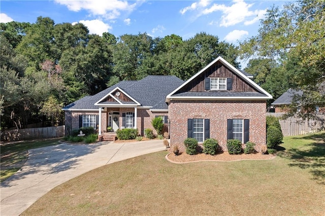 craftsman inspired home with a front lawn