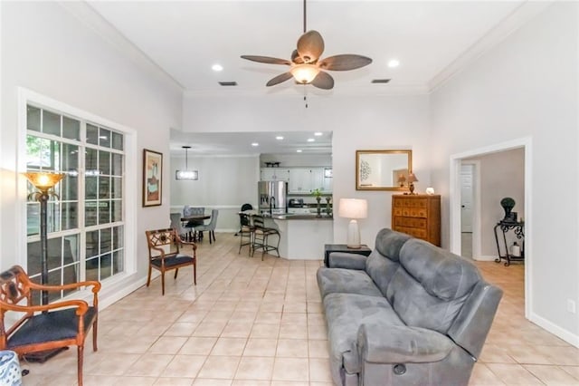 8814 Dawes Lake Rd N, Mobile, AL 36619 - living area featuring crown molding, baseboards, ceiling fan, and light tile patterned floors