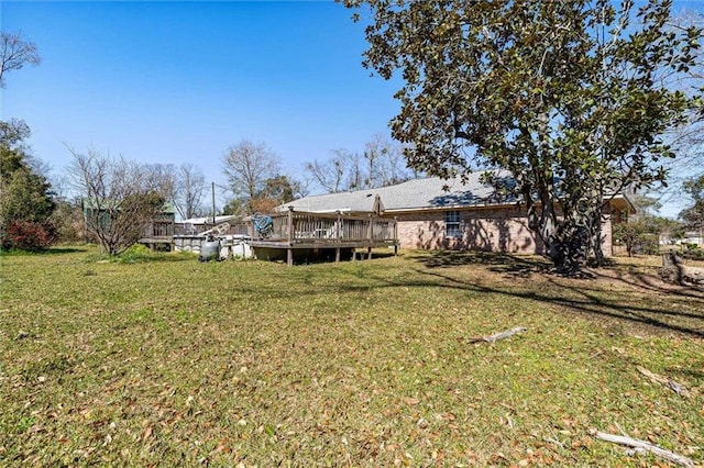 view of yard featuring a deck