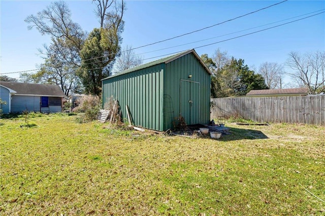 view of shed with fence