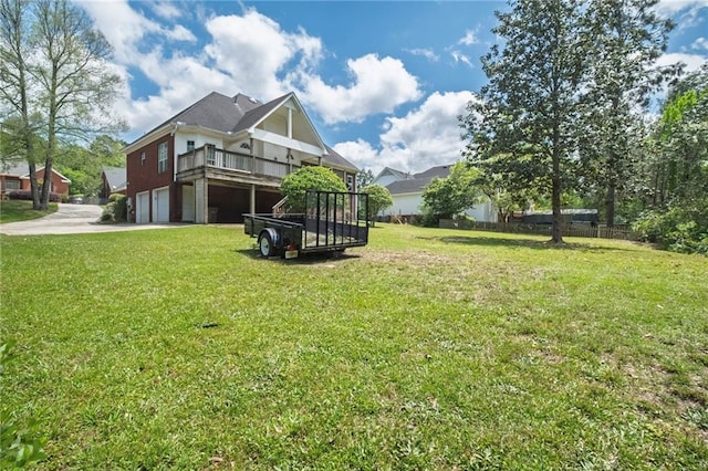 3424 Windsor Place Ct, Mobile, AL 36695 - view of green lawn featuring an attached garage, driveway, and a deck