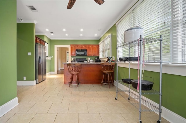 603 Glenwood St, Mobile, AL 36606 - kitchen with black microwave, stainless steel fridge, crown molding, a peninsula, and ceiling fan