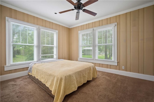 603 Glenwood St, Mobile, AL 36606 - carpeted bedroom with ornamental molding, multiple windows, baseboards, and a ceiling fan