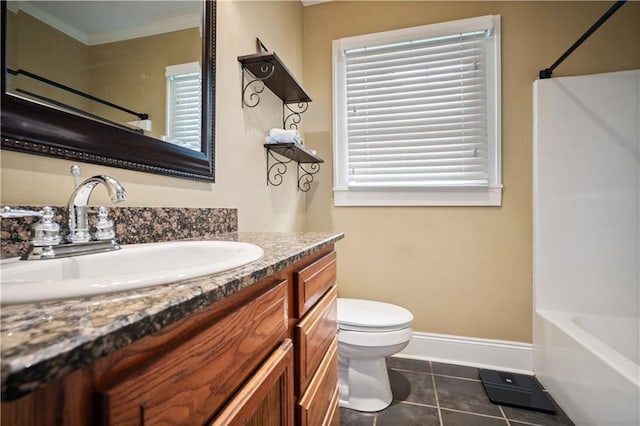 603 Glenwood St, Mobile, AL 36606 - full bathroom featuring toilet, vanity, ornamental molding, tile patterned flooring, and shower / bathtub combination