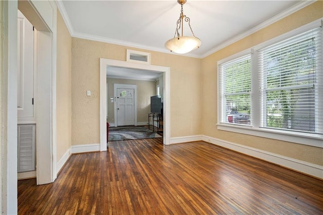 603 Glenwood St, Mobile, AL 36606 - unfurnished dining area with dark wood-style flooring, baseboards, and ornamental molding