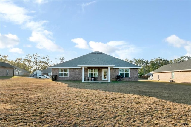 back of house with a yard