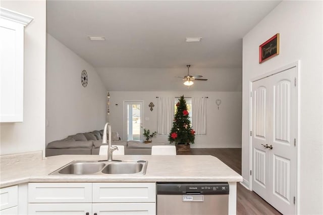 kitchen featuring dishwasher, dark hardwood / wood-style floors, white cabinetry, and sink