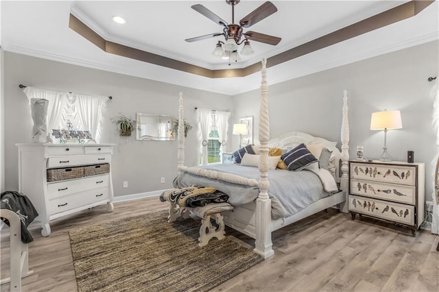 bedroom featuring crown molding, ceiling fan, and light wood-type flooring