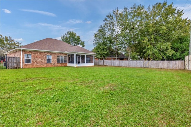 view of yard with a sunroom