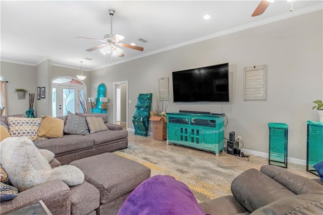 tiled living room featuring ceiling fan, french doors, and ornamental molding