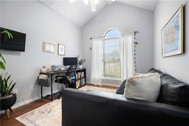 office area featuring lofted ceiling, dark wood finished floors, and baseboards