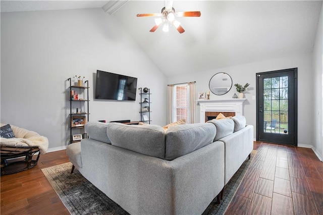 living room with beam ceiling, a fireplace, dark wood-type flooring, high vaulted ceiling, and baseboards