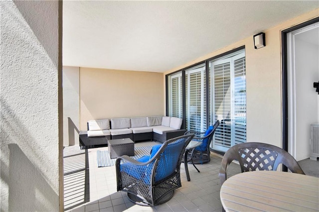 view of patio with an outdoor living space and outdoor dining space