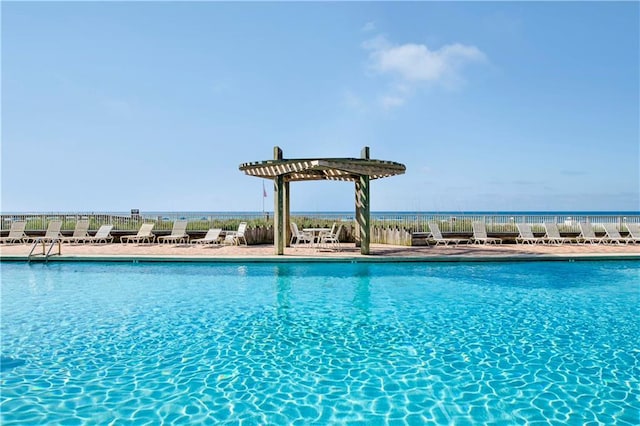 pool featuring fence and a patio area