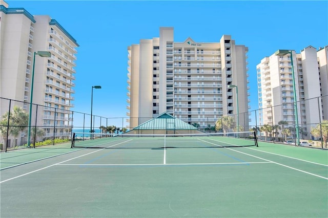 view of tennis court with fence