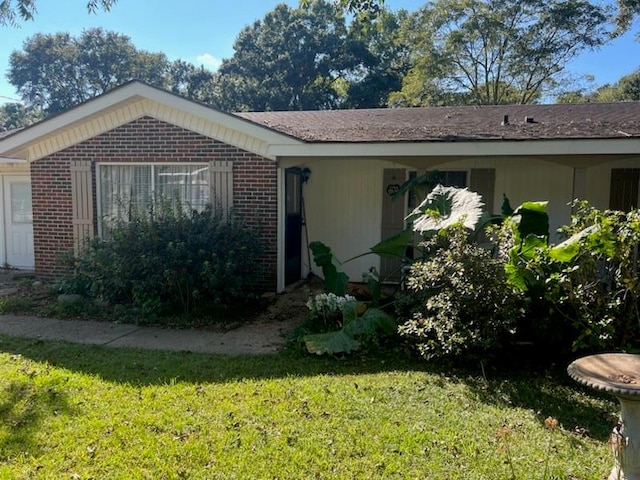 view of home's exterior with a lawn