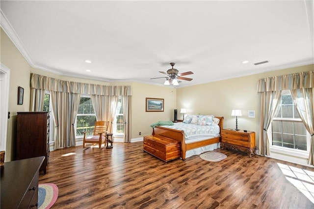 bedroom with crown molding, wood-type flooring, multiple windows, and ceiling fan