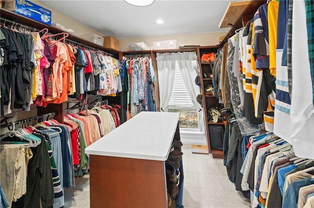 spacious closet featuring light tile patterned flooring