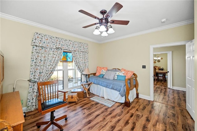 bedroom featuring dark wood-type flooring, ceiling fan, and ornamental molding