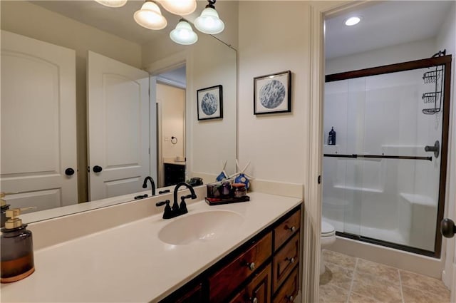 bathroom with walk in shower, toilet, and vanity