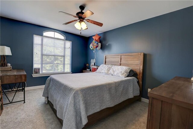 carpeted bedroom with ceiling fan