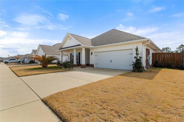 view of front of house with a garage and a front yard