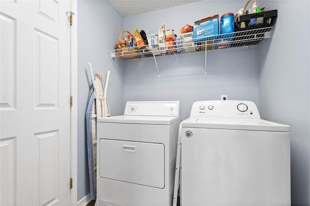 12601 Deer Ridge Dr, Wilmer, AL 36587 - washroom featuring washing machine and clothes dryer and a textured ceiling