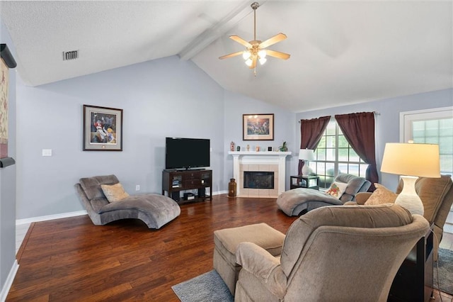 12601 Deer Ridge Dr, Wilmer, AL 36587 - living room with dark wood-style flooring, a ceiling fan, and a tiled fireplace