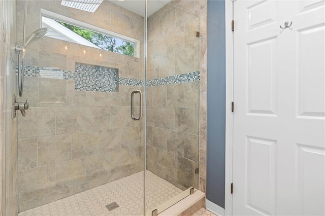 full bath with a shower stall