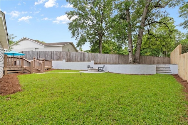 view of yard featuring a wooden deck