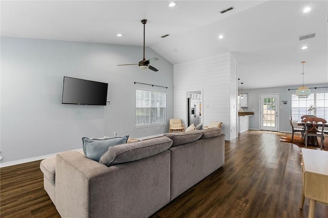 living area with a ceiling fan, dark wood-type flooring, baseboards, recessed lighting, and high vaulted ceiling