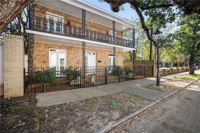 view of front of property with a balcony