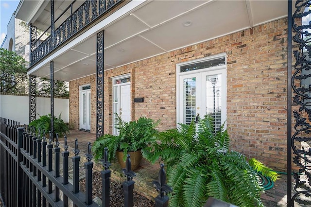 doorway to property featuring french doors and a balcony