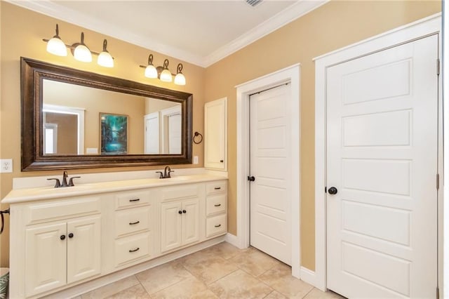 bathroom featuring double vanity, baseboards, ornamental molding, and a sink